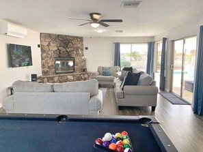 Living room with pool table.
