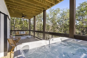 Hot tub on the deck with lake views