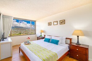 Bedroom with king-size bed, dresser, nightstand and closet