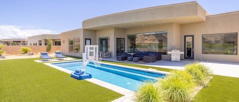 Back yard view of pool - View of the fun amenities available for you when you are a guest at our home.