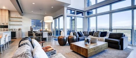 Great Room with massive windows looking out to the Uinta valley and mountains