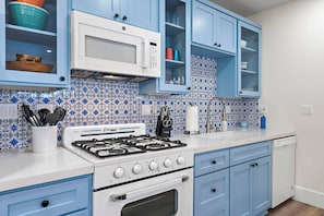 The kitchen is fully equipped enough to prepare almost any meal. It also has quartz countertops, new appliances, and a fridge with filtered water and ice.