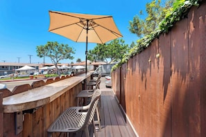 Enjoy a peak-a-boo ocean view, people watching and a gentle ocean breeze from your private deck right outside your condo.