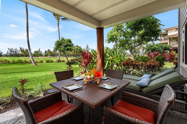 Enjoy a meal or stretch out on a chaise lounge from the covered lanai to enjoy the unobstructed golf course view and ocean breeze