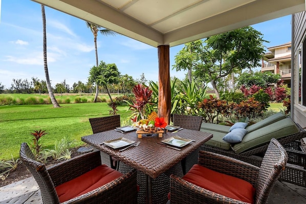 Enjoy a meal or stretch out on a chaise lounge from the covered lanai to enjoy the unobstructed golf course view and ocean breeze