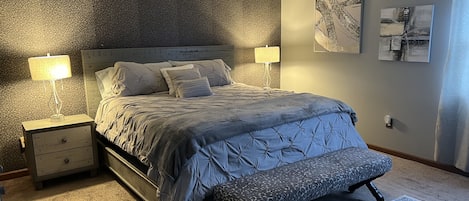 Master bedroom with king size bed and high quality sheets for comfort 