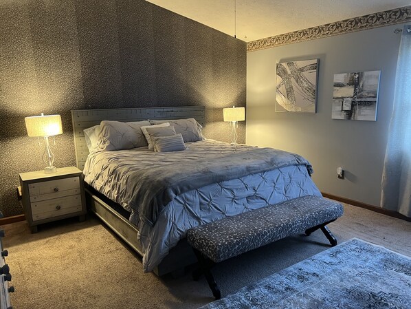 Master bedroom with king size bed and high quality sheets for comfort 