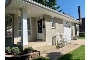 Front walk with 2 steps leading up to front porch.