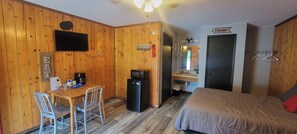 Table/chairs, tv, coffee pot