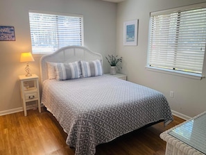 Primary Bedroom. Queen Bed, and TV in room
