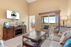 Living Room with Cable TV, Sleeper Sofa, and Direct Access to the Sunroom and Covered Deck