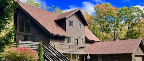 In autumn, vibrant fall colors surround the Chickadee Chalet; a relaxing getaway