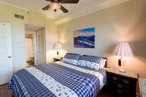 Master bedroom with king bed and attached bathroom
