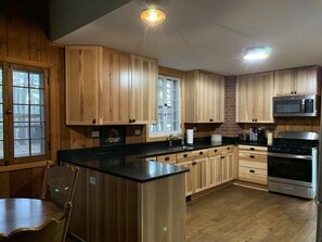 All new kitchen with granite counters and hickory cabinets.