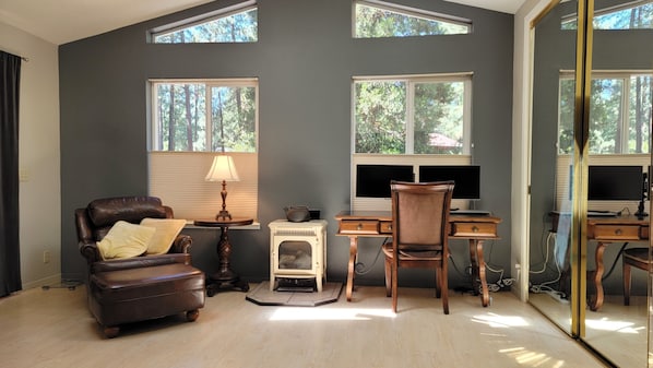 Primary retreat features work area and gas fireplace