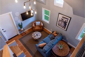 Looking down from the loft to the living room