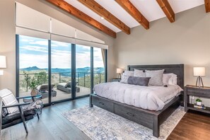 A grand master suite with direct deck access, complete with incredible 180° views of Bailey's majestic peaktops.