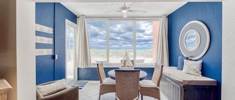 Sun room with door to beach