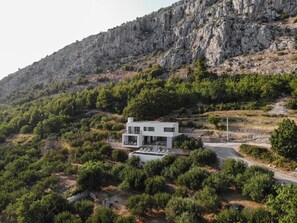 Aerial photo of Villa Marmoris surrounded with olive fields. 