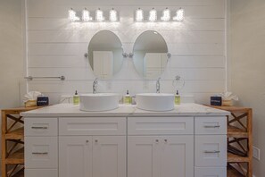 Master bathroom with extra large luxury shower with three shower heads 