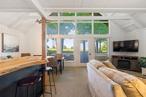 Main floor views to the back deck, golf course, and mountains.