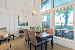 Dining area with seating for six, and seating for three at the custom bar.