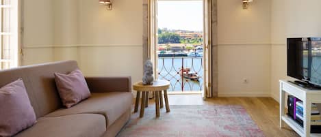 Stunning living area, with a breathtaking view to the river and a TV for your entertainment, perfect for a lovely summer evening #sublime #dreamy #airbnbporto #lovelystay