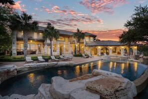 View of back of home at sunset