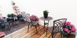Garden Patio with decked and pebbled areas
2 bistro tables
4 garden chairs