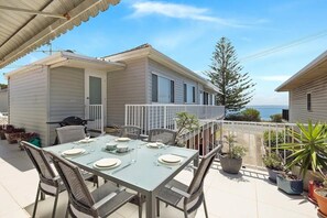 Outdoor balcony and furnishings with water view
