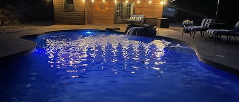 Private pool at night (with pool house)