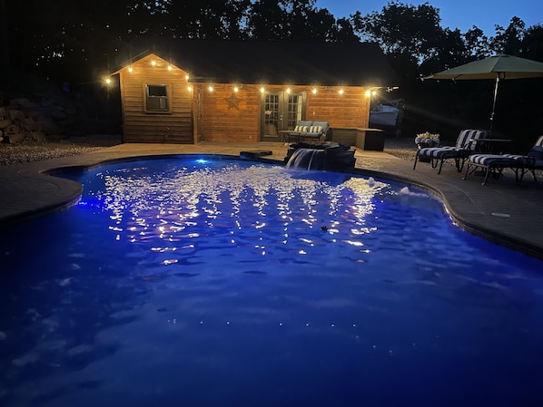 Private pool at night (with pool house)