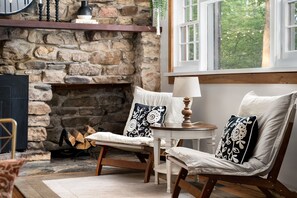 Cozy seating near indoor gas fire place in Living area 1