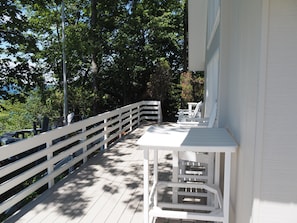 EXTERIOR: Another portion of the huge wrap-around deck