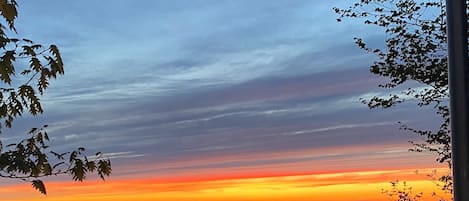 EXTERIOR:  A beautiful sunset on Lake Michigan looking from the cottage.