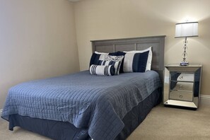 Second bedroom with Queen bed and lots of natural light with beautiful shutters!