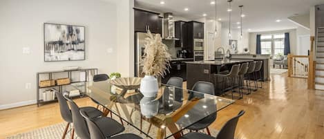 Glass top dining table comfortably sits eight