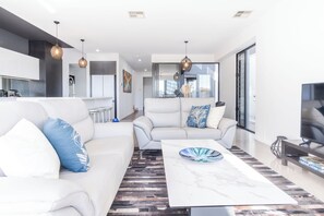 Cosy lounge room and large TV.