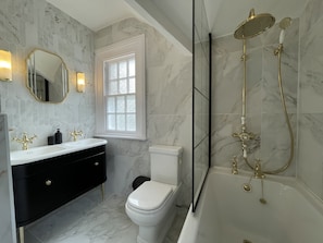 The bathroom is found on the 1st floor of the property