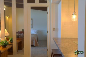 Living room, kitchen view into bedroom