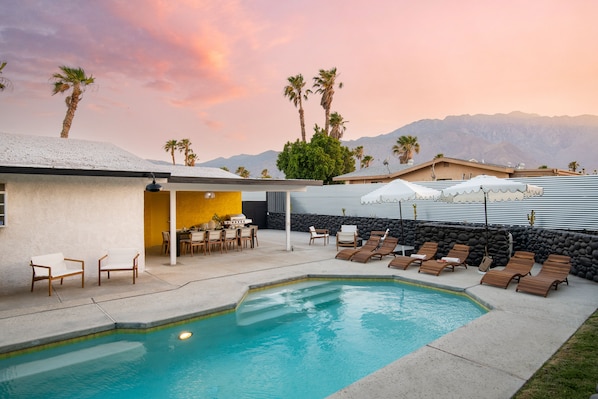 Incredible entertainer's backyard with a pool and mountain views.