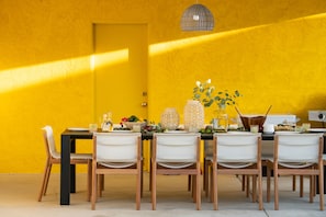 PIcturesque outdoor dining area with a huge table.