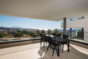 Outdoor dining area with views over Estepona and the Med