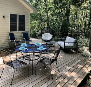 Back deck with hot tub. - Back deck with hot tub.