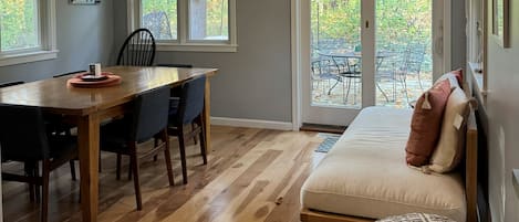 Dining area with access to outside with hot tub.