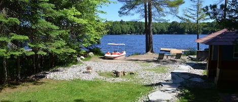 lakefront, sandy beach area & paddle boat