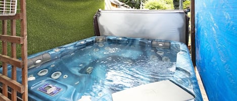 Enjoy the under cover Hot Tub all year round