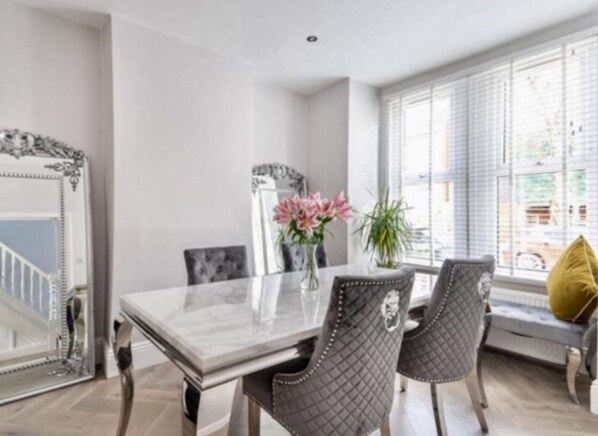 Large elegant dining Rm, marble table, velvet chairs -perfect dining experience.