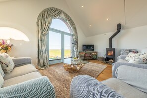Anchorage, Salthouse: Sitting area with a wood burning stove