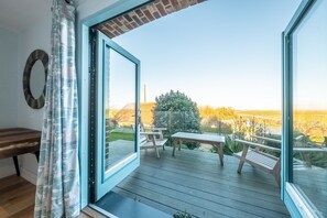 Anchorage, Salthouse: Master bedroom with a balcony over looking the marshes